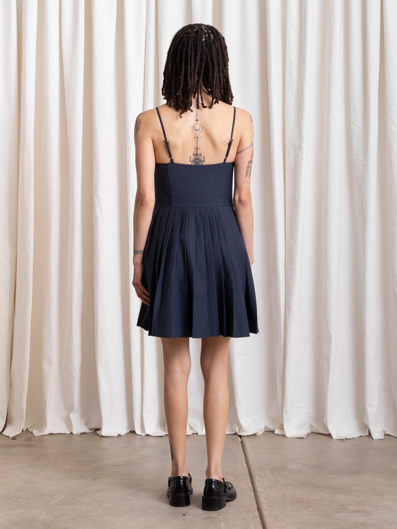 PLEATED MINI DRESS - DEEP NAVY