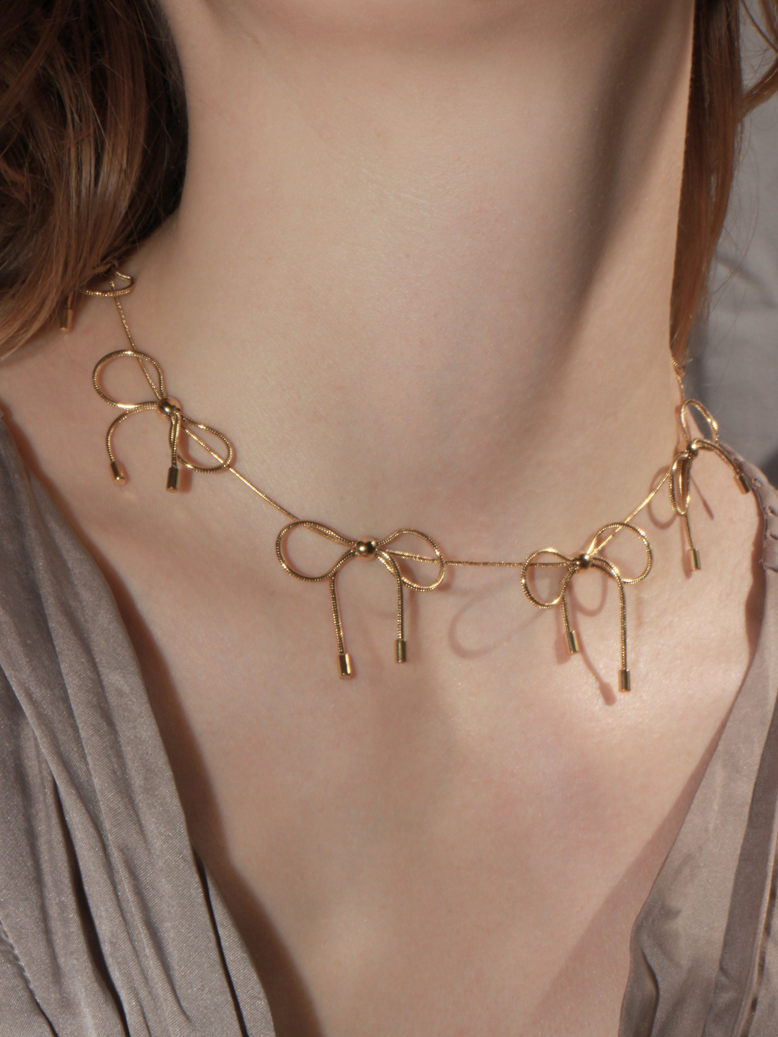 BOW NECKLACE - GOLD